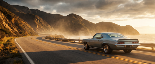 Cinematic 1969 Chevrolet Camaro American muscle car on a dramatic road at golden hour