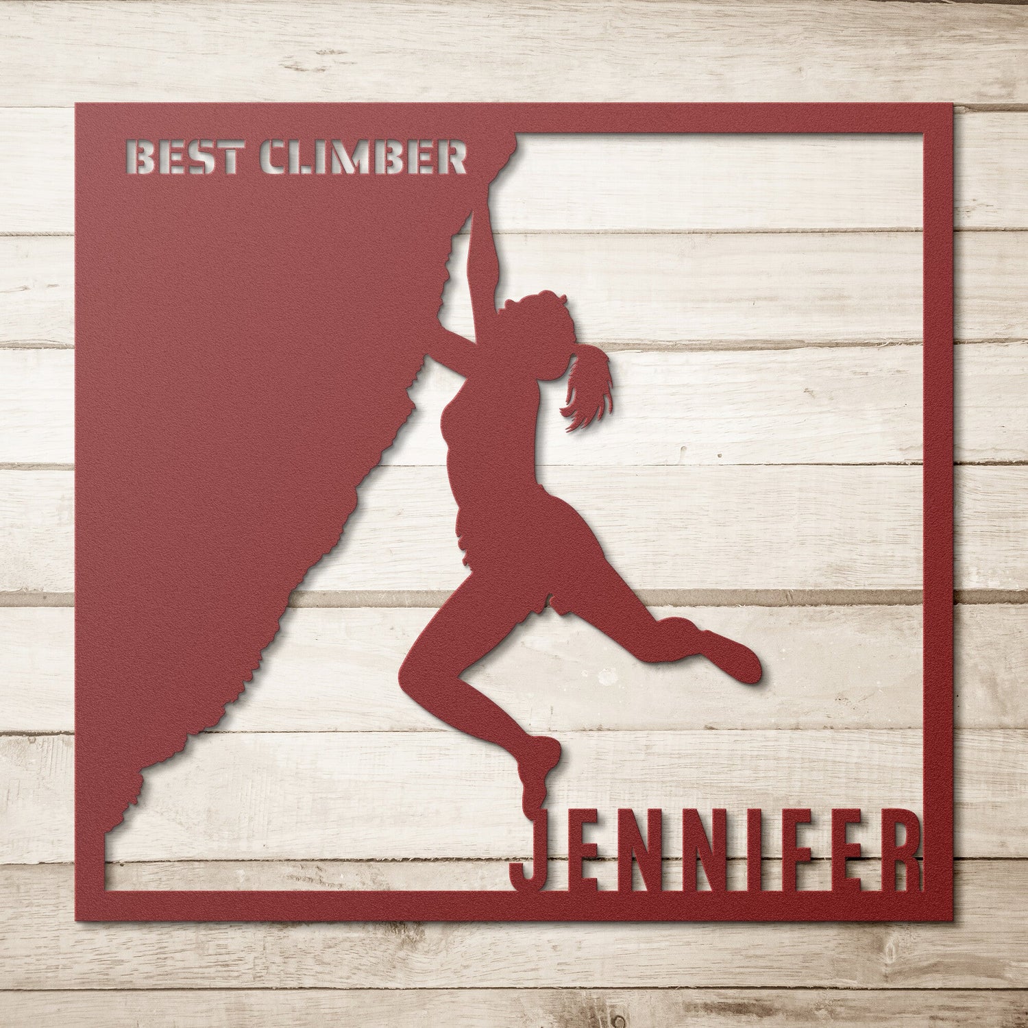 Silhouette of a female climber on a metal cutout. Text reads "Best Climber" and "Jennifer.