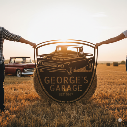 Two people hold a personalized 1960 Chevy C10 Metal Garage Sign with "GEORGE'S GARAGE EST 1967" in a field at sunset, hay bales and vintage truck decor in the background—a perfect gift for Dad or collectors.