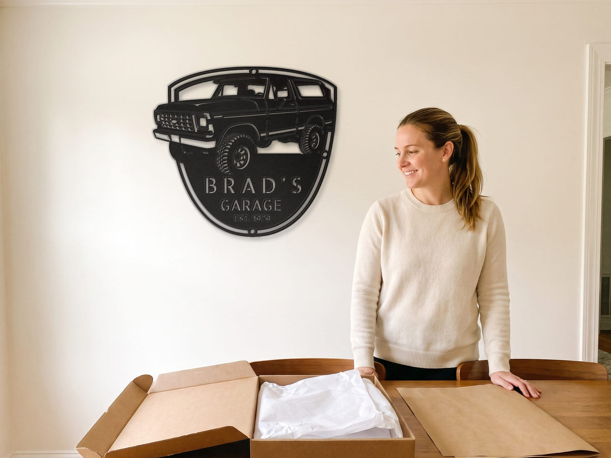 Woman unboxing a full-size Ford Bronco metal name sign, a Ford Bronco gift for him