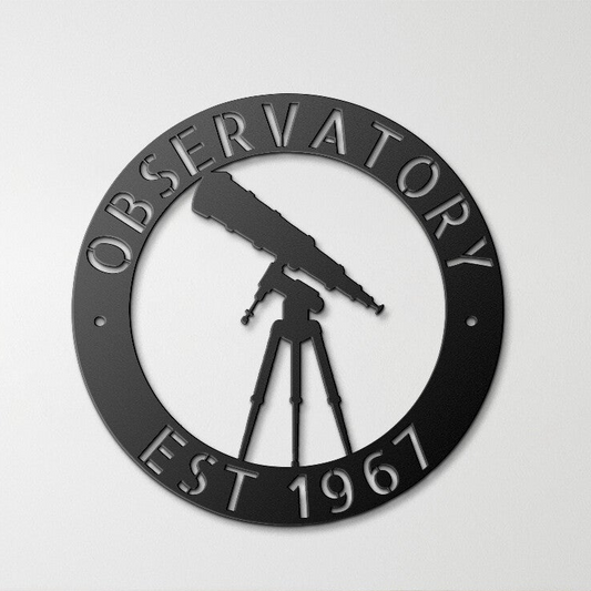 a metal sign with a telescope on top of it