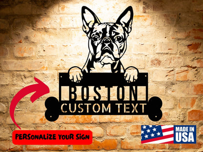 Wall-mounted sign depicting a bulldog holding a customizable text plate, with a "Personalize Your Sign" label and an American flag icon indicating "Made in USA" in the bottom right corner. This Custom Boston Terrier Dog Sign, Personalized Dog Steel Monogram Wall Art, Unique Home Decor, Boston Terrier Lovers Gift brings charm and style to any space.