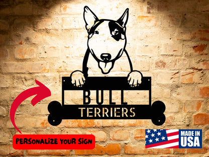 Personalized Bull Terrier Dog Name Sign, Custom Dog Wall Art, Unique Pet Home Accent, Gift for Bull Terrier Admirers featuring a Bull Terrier holding a plaque that reads "Bull Terriers." Text indicating "Personalize Your Sign" with an arrow pointing at the plaque. Perfect for custom pet wall art and personalized home decor. "Made in USA" label at the bottom right.