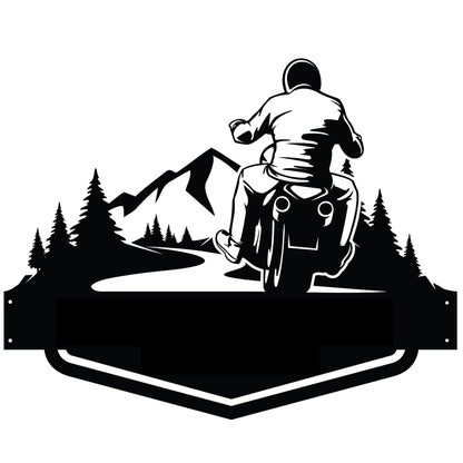 a person riding a motorcycle on a road with mountains in the background