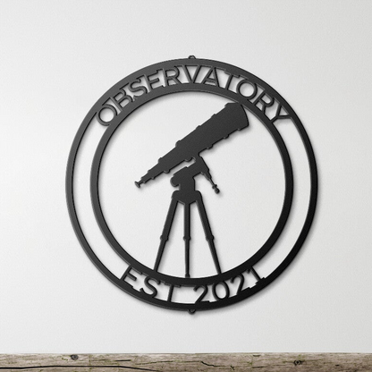 a metal sign with a telescope on top of it