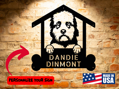 Metal sign featuring an illustration of a Dandie Dinmont in a house-shaped frame, with the text "Dandie Dinmont". Includes a "Made in USA" label and a red arrow pointing to a note, "Personalize Your Sign". Perfect as Dandie Dinmont Dog Name Sign, Personalized Dog Wall Art, Handcrafted Pet Home Decor, Dandie Dinmont Lovers Gift Wall Art!