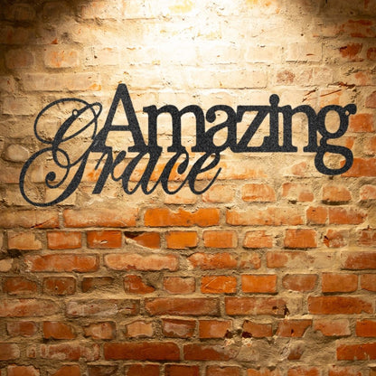 A custom handcrafted steel sign displaying "Amazing Grace" on a brick wall.