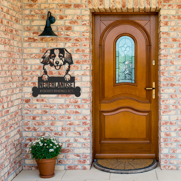 A wooden door with a Custom Kooikerhondjes Dog Sign | Personalized Steel Monogram Wall Art on it.