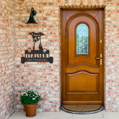 A wooden door with a Personalized Italian Greyhound Sign | Custom Dog Breed Steel Monogram Wall Art | Customized Pet Welcome Sign Home Decor next to it.