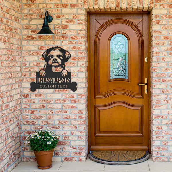 A front door with a Personalized Lhasa Apso Dog Name Sign and a potted plant.