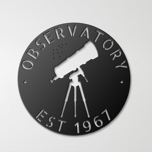 a black circular sign with a telescope on it