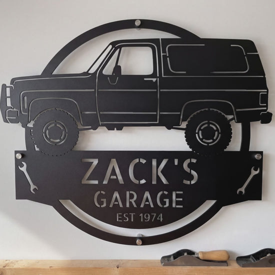 Personalized 1973 K5 Blazer garage sign video: the laser-cut steel sign with his name and EST year, hung on the garage wall