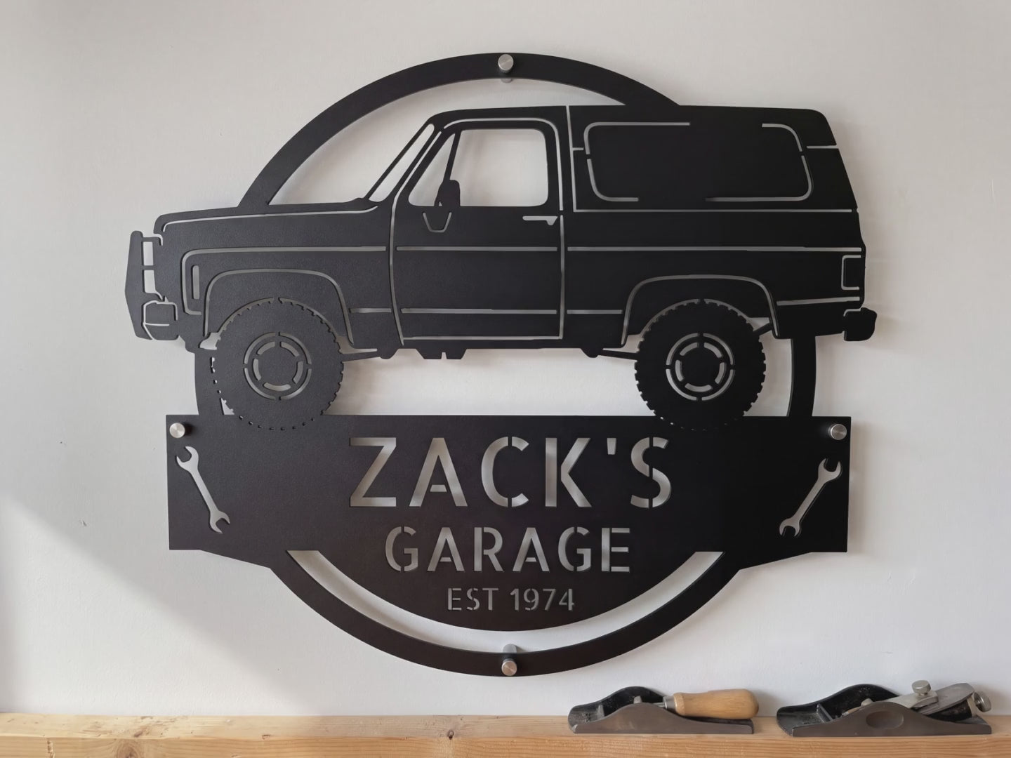 Personalized 1973 K5 Blazer garage sign video: the laser-cut steel sign with his name and EST year, hung on the garage wall