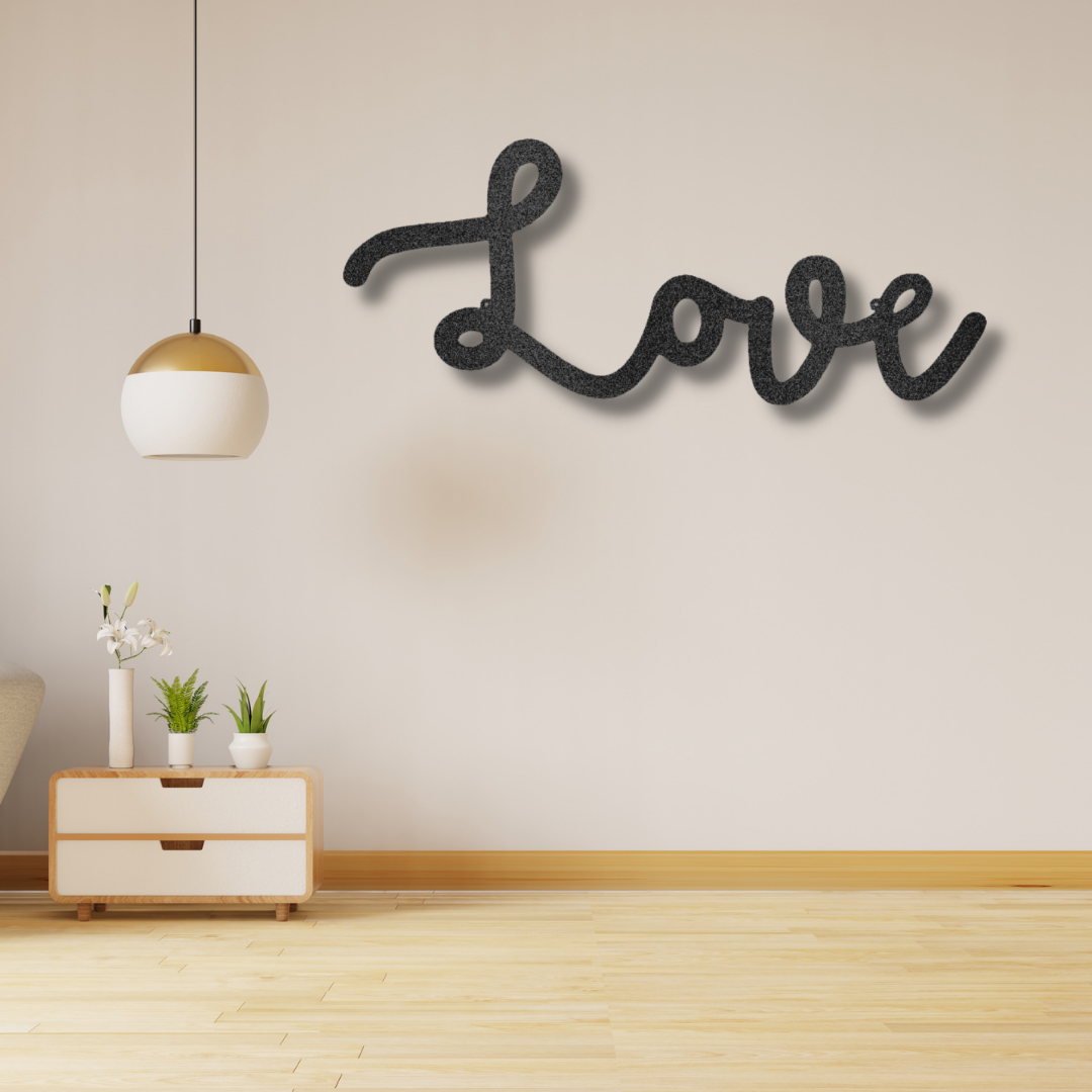 A Personalized Steel Monogram love script sign hanging on a brick wall.