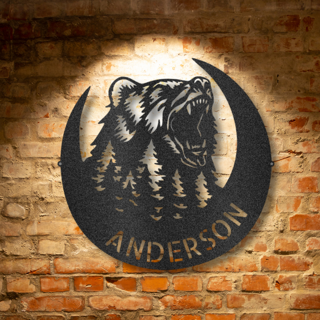 A Custom Handmade Roaring Bear Monogram - Steel Sign with a tree in the middle of a brick wall, perfect for unique metal art gifts.