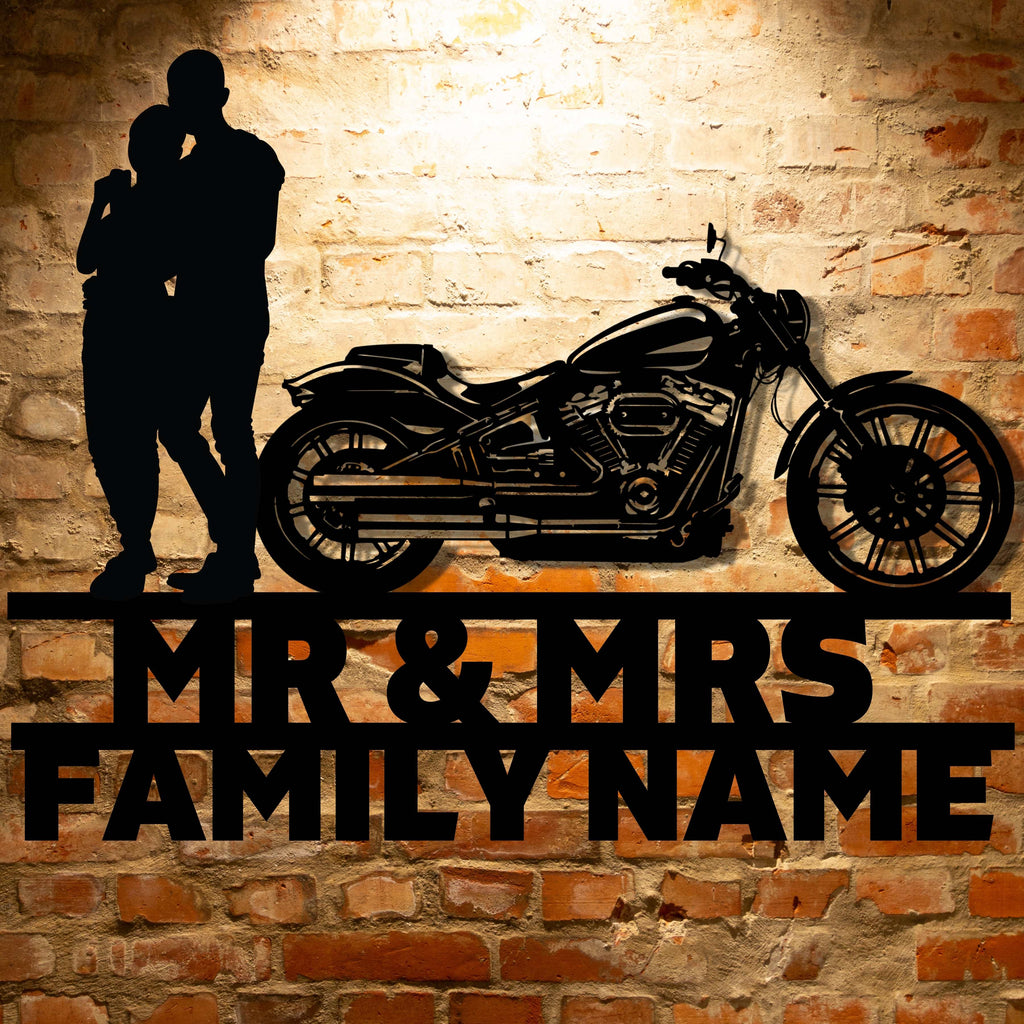 A personalized metal family wall art featuring a silhouette of a Mr&Mrs Harley-Davidson couple SET 13 on a brick wall.