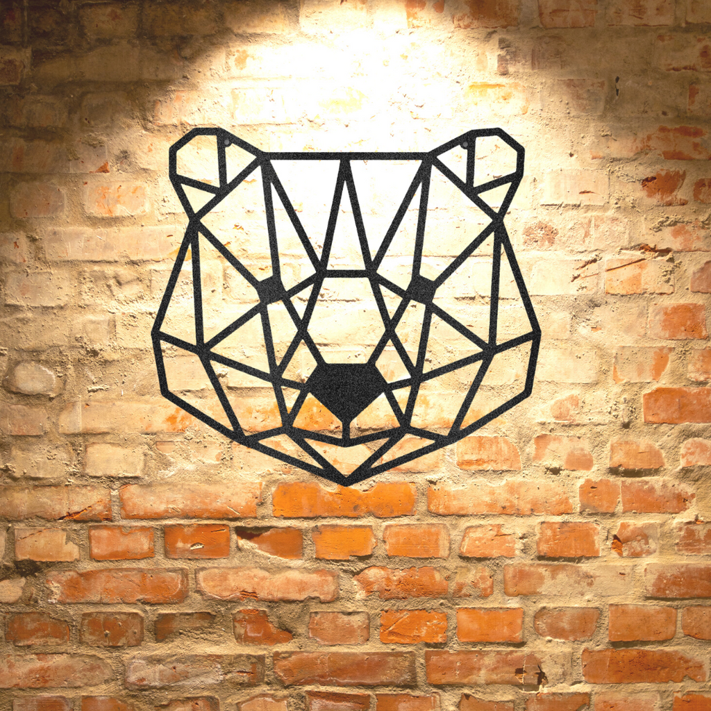 A durable steel sign featuring a geometric bear, hanging on a brick wall.