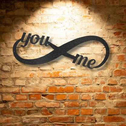 A Personalized Steel Monogram with the words you me on it.