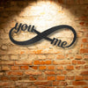A Personalized Steel Monogram with the words you me on it.
