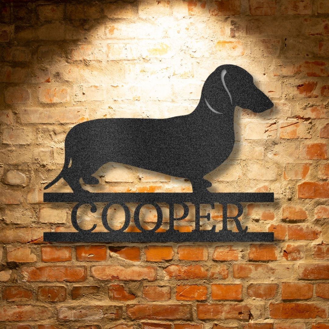 A Durable Outdoor Metal Dachshund Monogram Wall Art Decor on a brick wall.