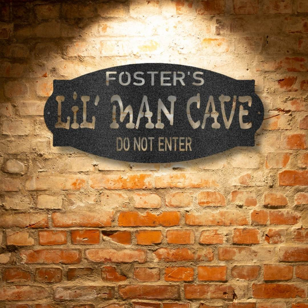 A durable outdoor metal sign that says Personalized Lil Man Cave - Steel Sign do not enter.