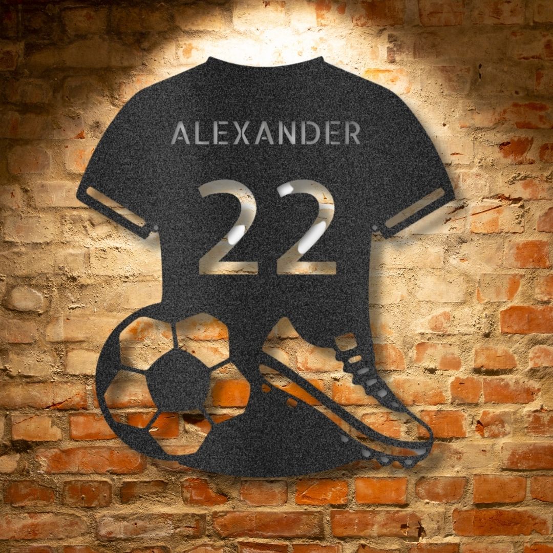 A durable outdoor metal sign featuring a custom handmade design of a soccer jersey monogram with the name Alexander 22 personalized on it.