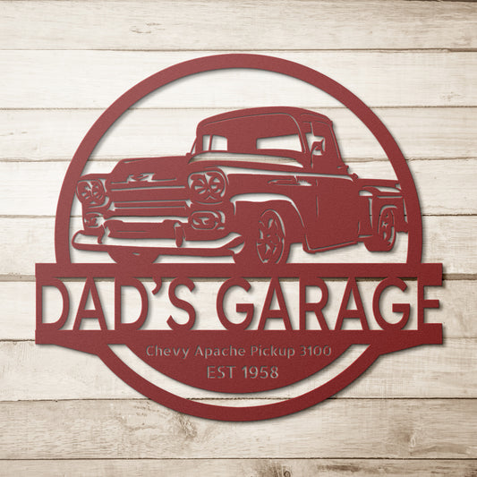 A steel monogram sign named "CAR GARAGE SIGN - Custom Car 1958 Chevy Apache Pickup 3100" showcases a vintage 1958 Chevy Apache Pickup with "Dad's Garage" and "Est 1958," seamlessly integrated onto a rustic wooden background.