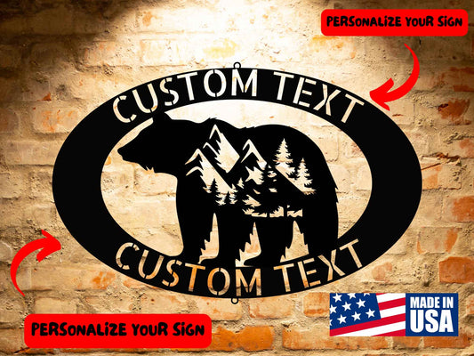 The BEAR MOUNTAIN SIGN - Customized Bear Mountain Pattern Steel Monogram features a bear silhouette set against mountain scenery. Crafted from 18 gauge steel, it offers areas for personalized text and is proudly labeled "Made in USA.