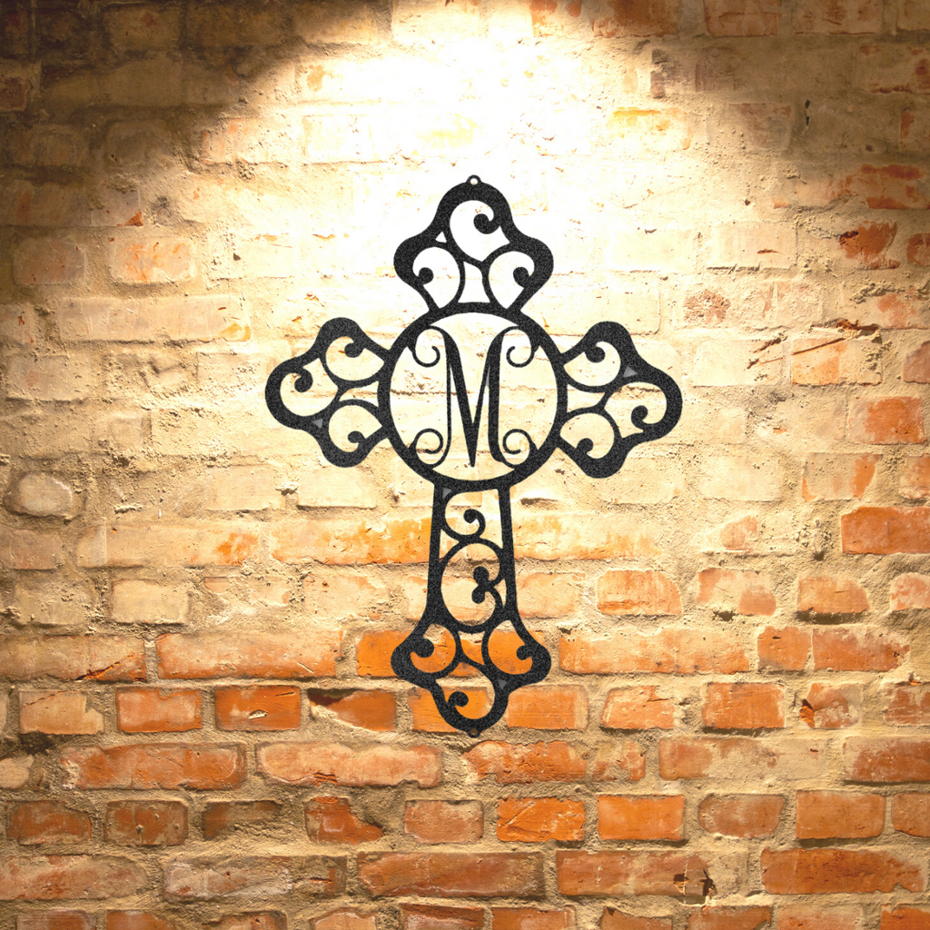 A Durable Outdoor Metal Sign with a Personalized Steel Monogram hanging on a brick wall.