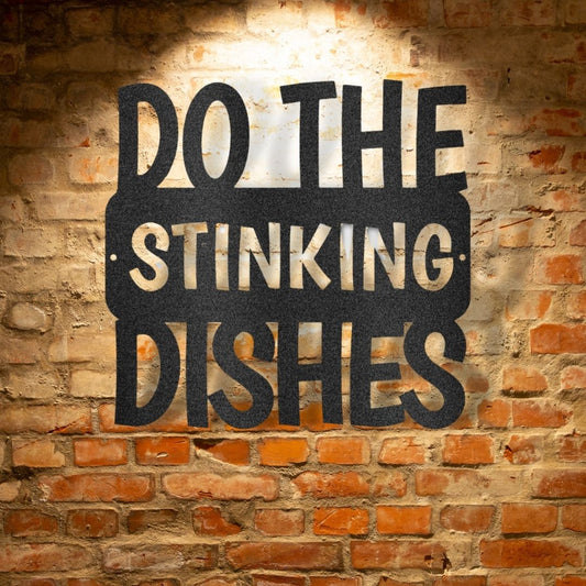 A personalized steel monogram sign, featuring a "Do the Dishes" quote, displayed on a brick wall.