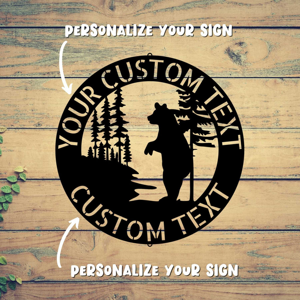 A black BEAR METAL SIGN - Customized Bear Established Steel Monogram Wall Sign on a wood surface, creating Personalized Family Signs.