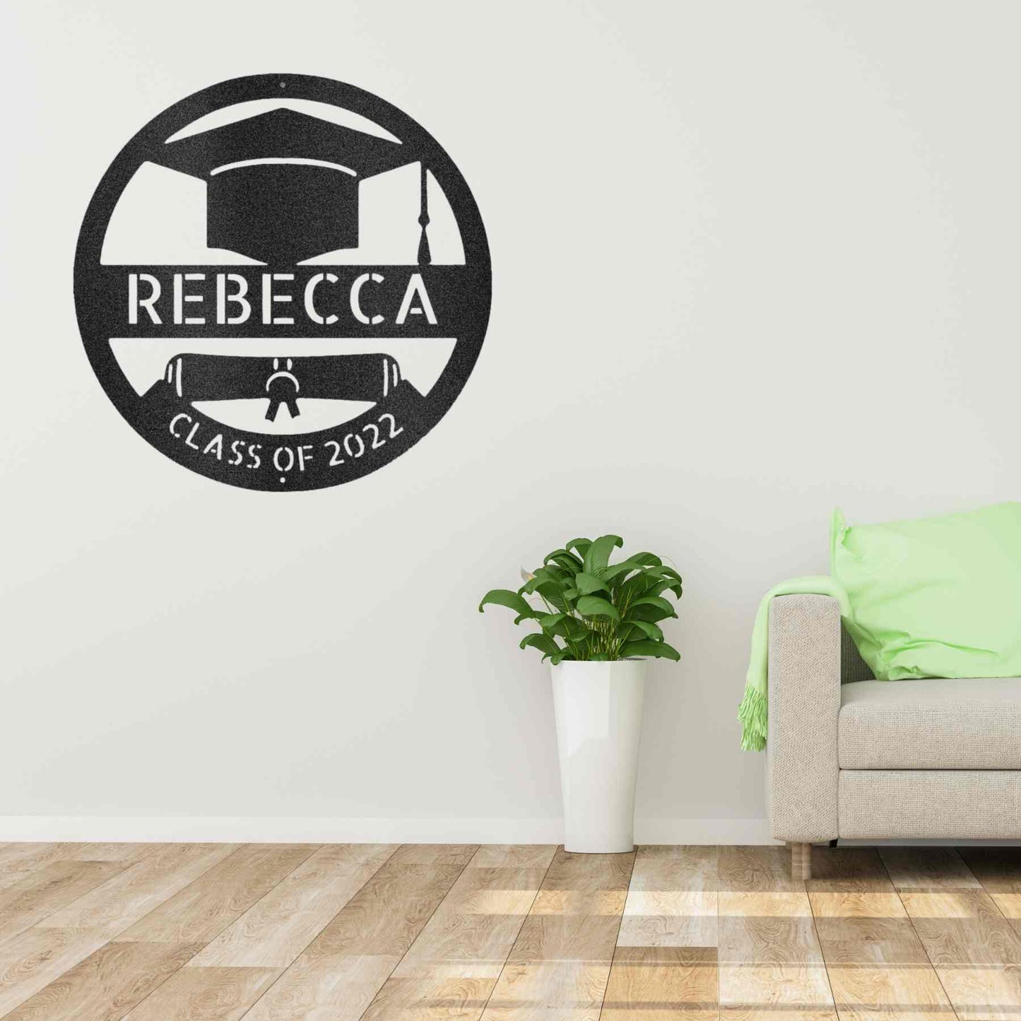 A durable outdoor metal sign with a custom handmade design of a grad cap monogram with the word Rebecca on it.