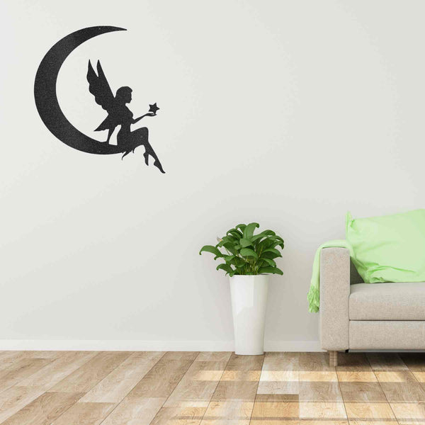 A personalized Fairy Moon - Steel Sign with custom handmade designs, sitting on a crescent on a brick wall.