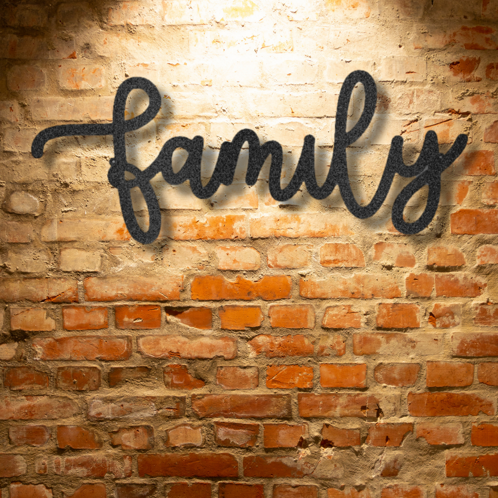 Metal Family Wall Art - The Family Script - Steel Sign is hanging on a brick wall.