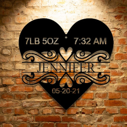 A durable, personalized steel monogram - Newborn Love Monogram - hangs on a brick wall.