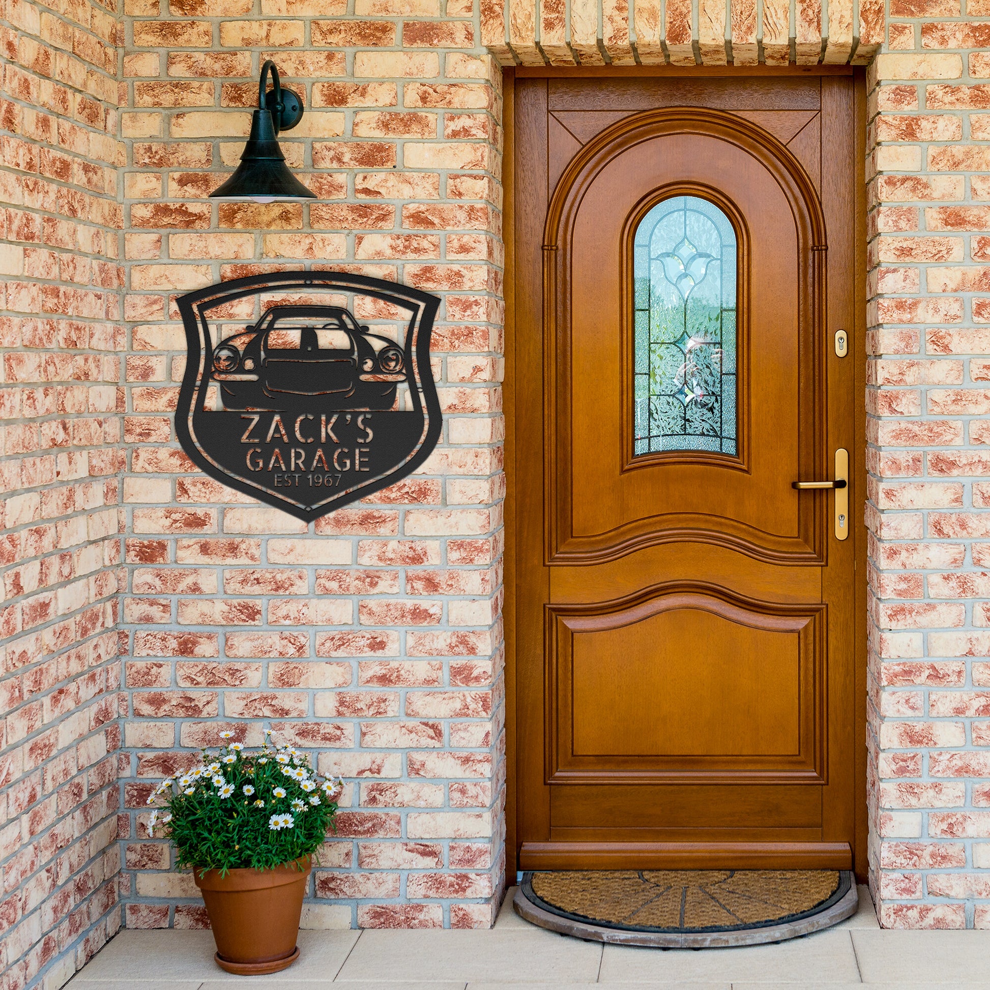 A CUSTOM CAR STEEL SIGN displayed on a brick wall.