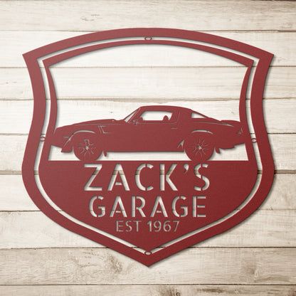 A custom vintage car monogram sign featuring a 1978 Chevrolet Camaro Z28 on a brick wall.