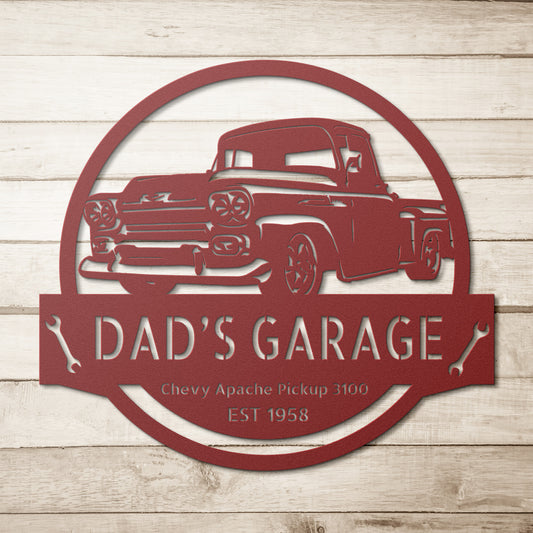 This personalized car sign, titled the "Chevy Apache Pickup 3100 1958 Car Steel Monogram Sign," showcases a red Chevy Apache Pickup 3100 along with the text "Dad's Garage, EST 1958." It's an ideal piece for infusing nostalgia into your interior design, featuring a powder-coated finish that provides durability against its rustic wooden background.