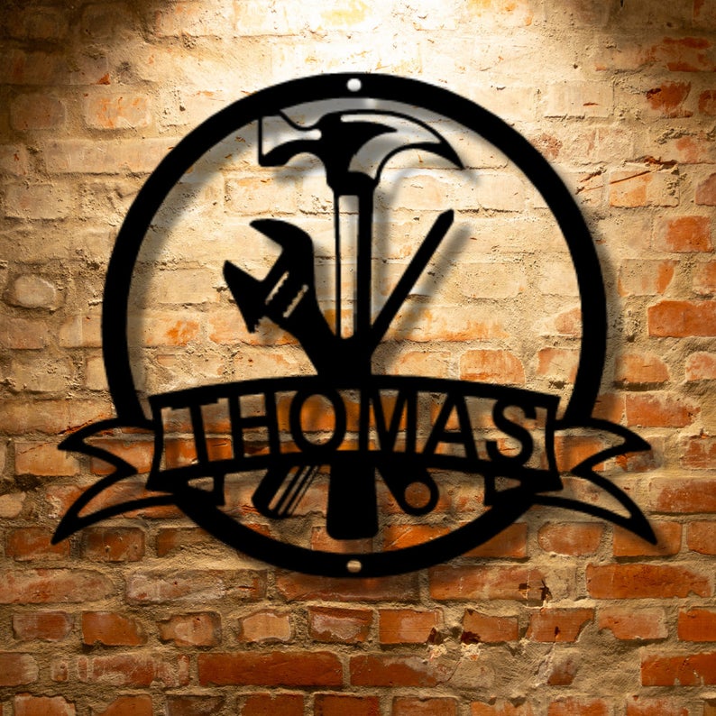 A unique Metal Personalized Established sign with the name Thomas on it.