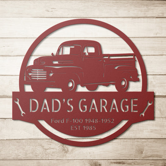 A metal sign in red showcasing a Ford F-100 truck from 1948-1952 with corresponding text.