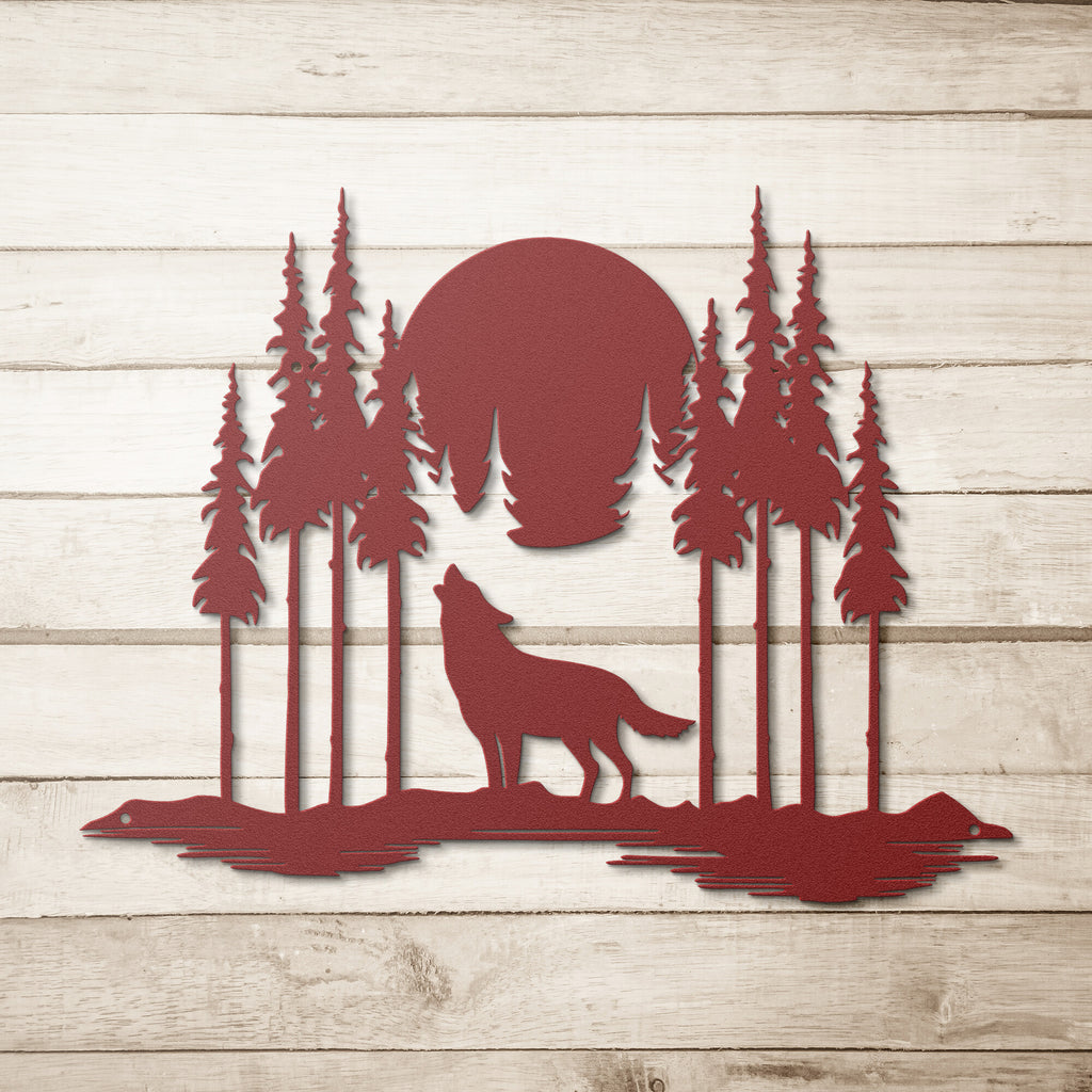 A personalized metal wall art decor with a howling to the moon steel monogram, surrounded by trees in the woods.