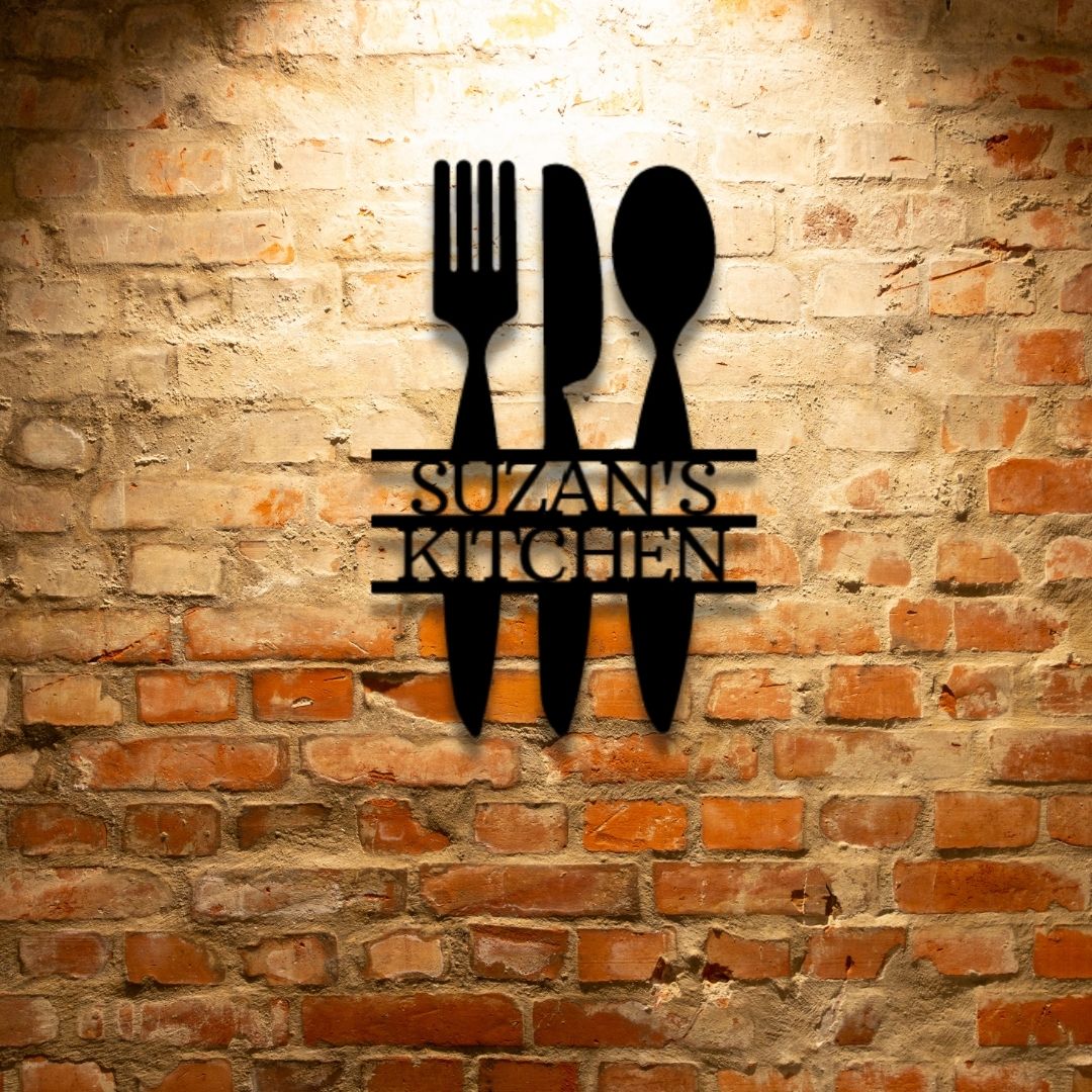 A unique, personalized Metal Wall Art Decor Monogram featuring custom handmade designs and a knife, fork, and spoon, hanging on a brick wall.