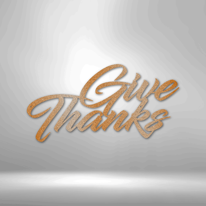 A durable metal sign displaying "Give Thanks" on a brick wall, perfect for outdoor decor.