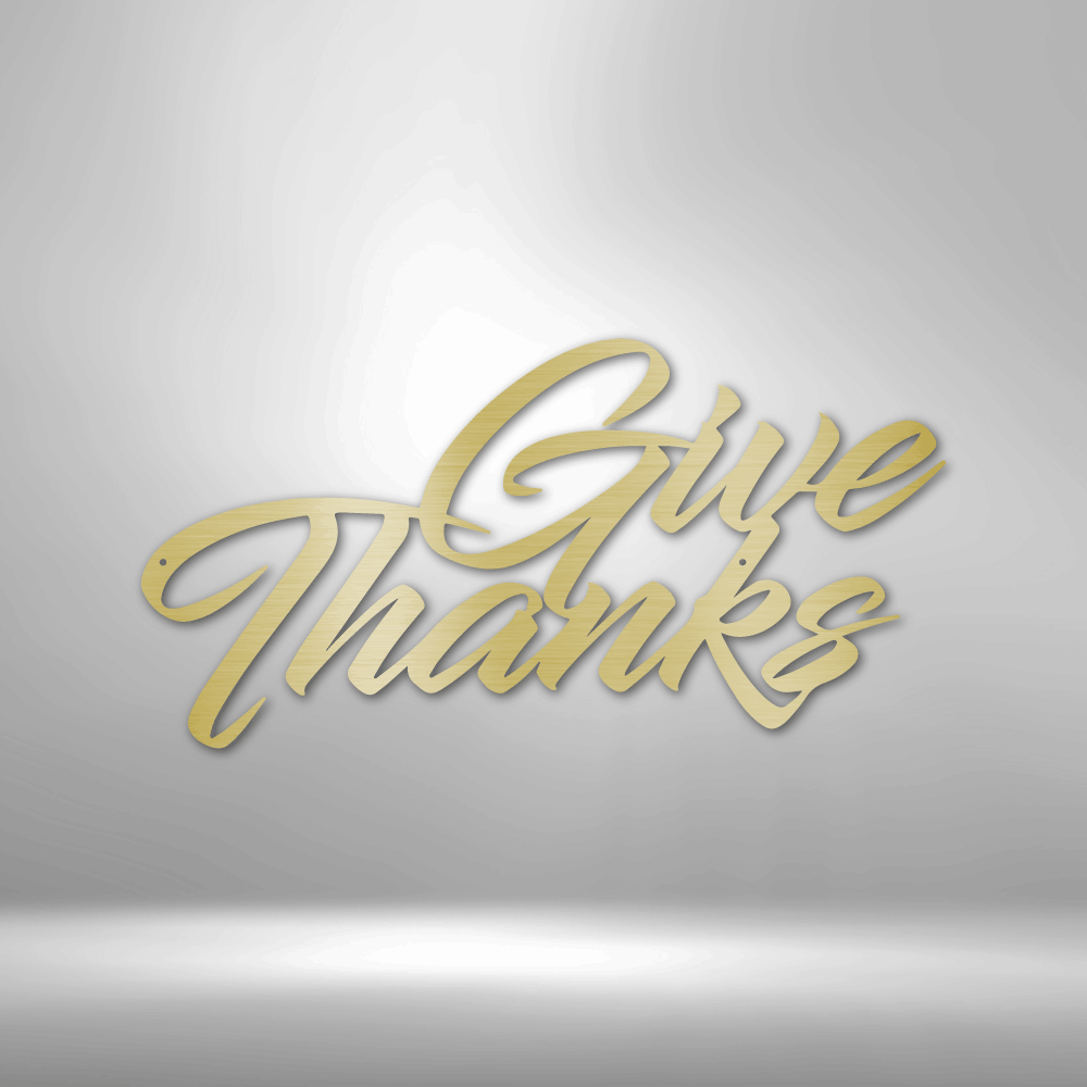 A durable metal sign displaying "Give Thanks" on a brick wall, perfect for outdoor decor.