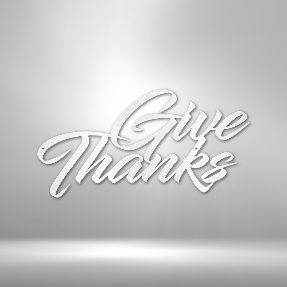 A durable metal sign displaying "Give Thanks" on a brick wall, perfect for outdoor decor.