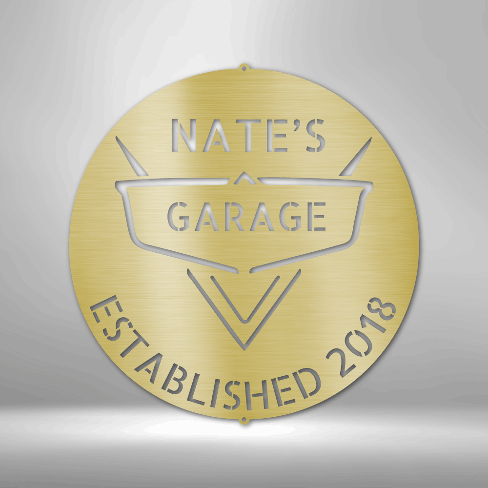 A PERSONALIZED Steel Monogram Garage Decor - Metal Wall Art that says nate's garage established 2018 on a brick wall.