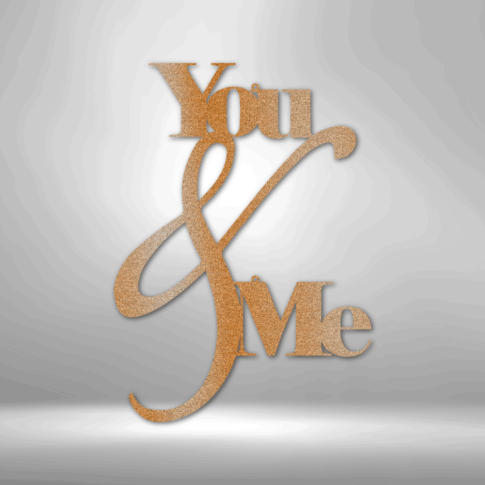 Metal Wall Art Decor - You and Me Quote on a steel sign displayed on a brick wall.