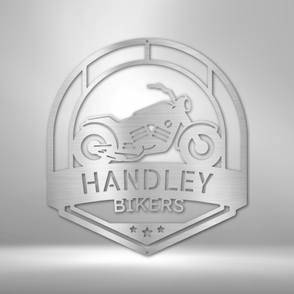 A Classic Car Steel Monogram - Steel Sign that says handley bikers on a brick wall.