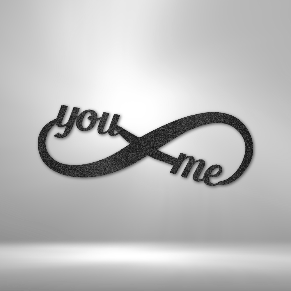 A Personalized Steel Monogram with the words you me on it.