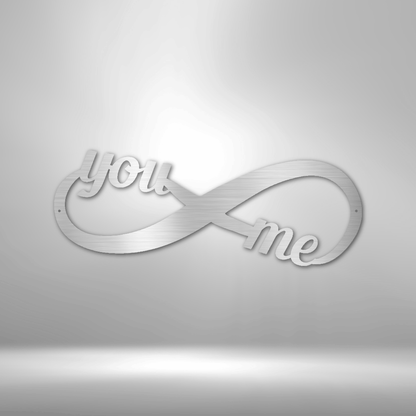 A Personalized Steel Monogram with the words you me on it.